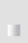 Maginista Plasticity Hair Mask Parfymefri i en hvit krukke mot lys grå bakgrunn