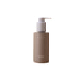 Waphyto Balance Body Oil i en taupefarget flaske med pumpe mot hvit bakgrunn